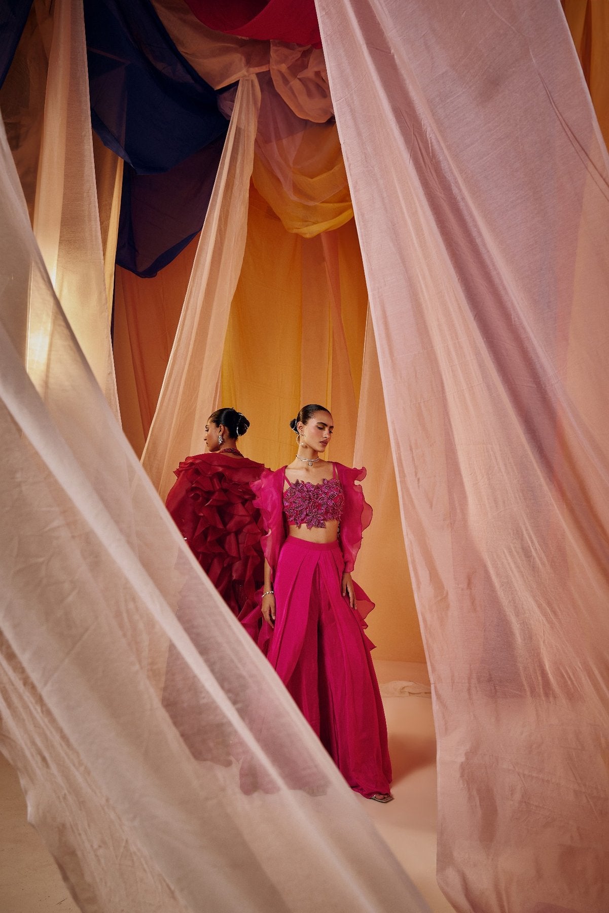 RUBY RED FULLY EMBROIDERED HALTER BLOUSE WITH DRAPE SKIRT AND RUFFLE ORGANZA CAPE