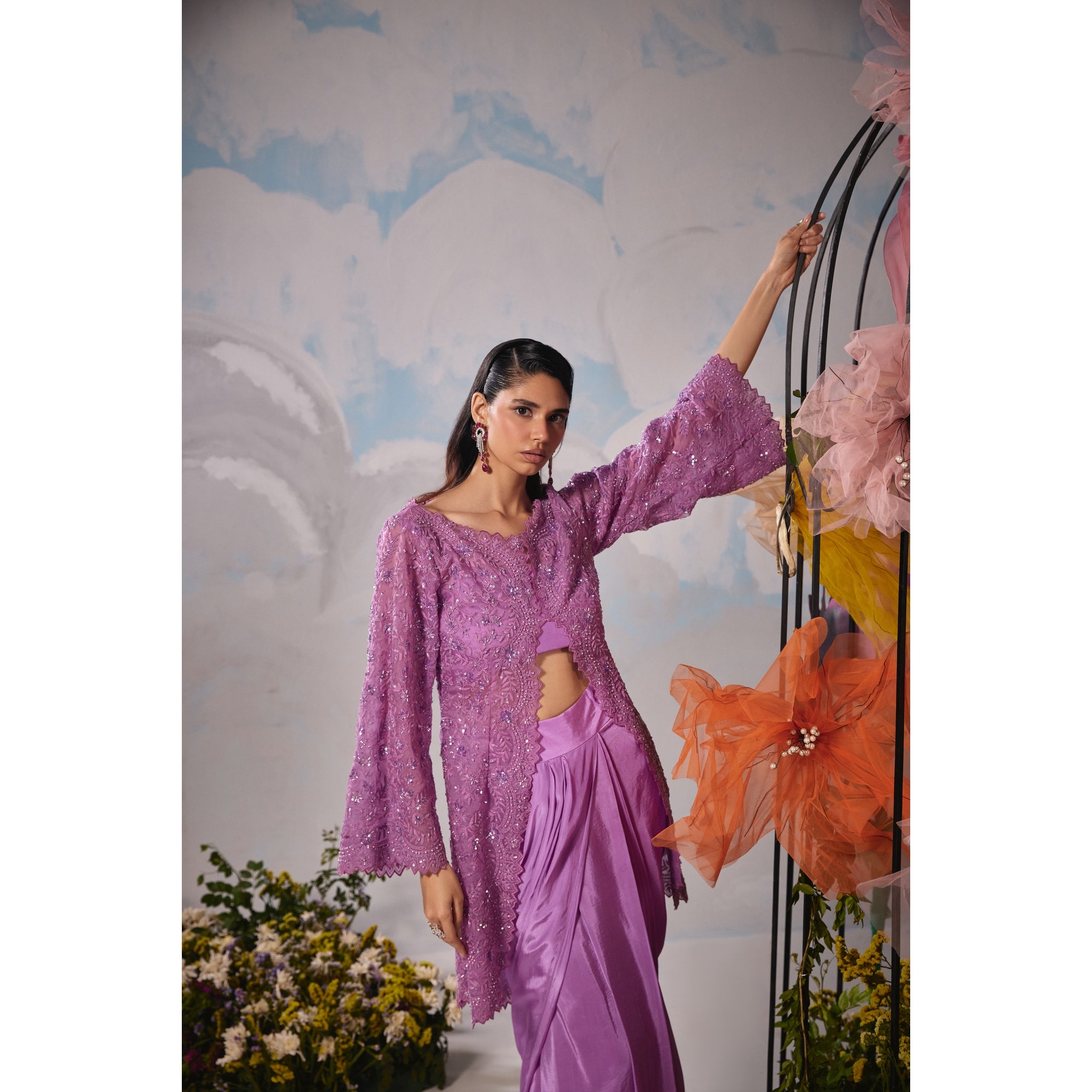 Lavender organza jacket with self dori embroidery paired with drape skirt and bustier