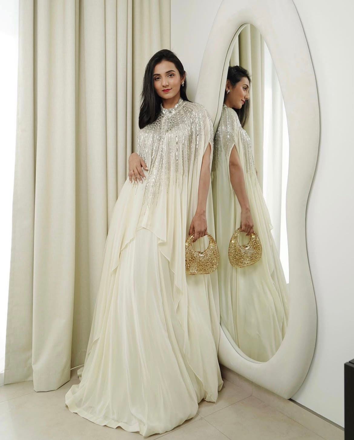 Massoom Minawala in Ivory Cape Lehenga Set