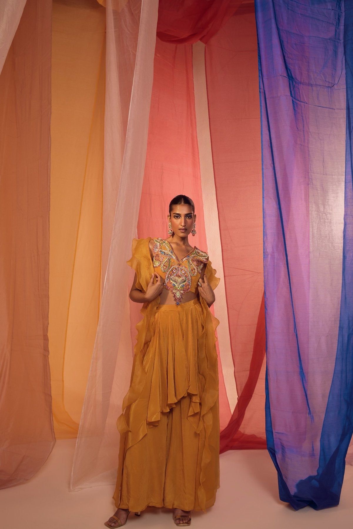 MUSTARD RUFFLE CAPE WITH EMBROIDERED NECK DETAIL BLOUSE AND DRAPE PANTS
