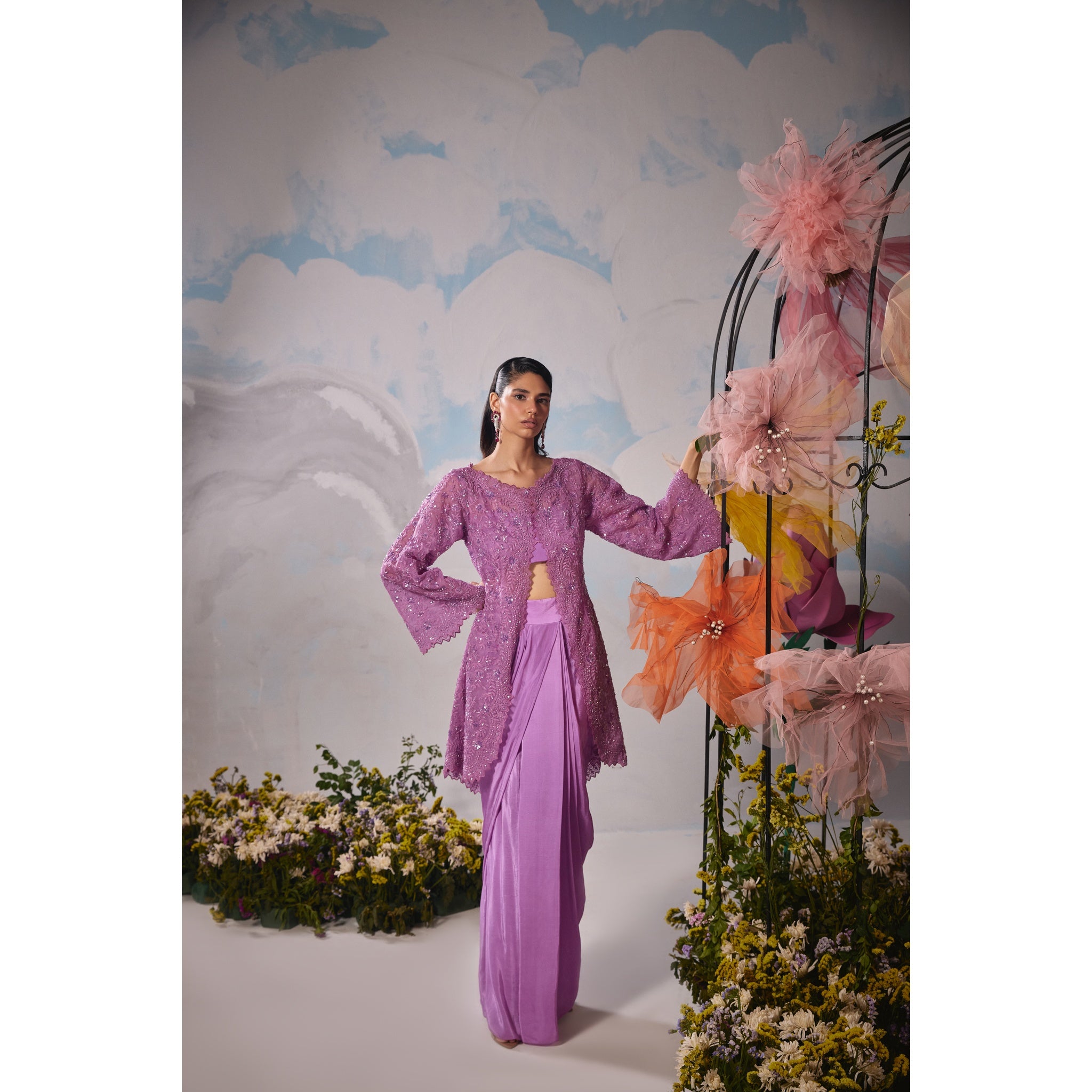 Lavender organza jacket with self dori embroidery paired with drape skirt and bustier